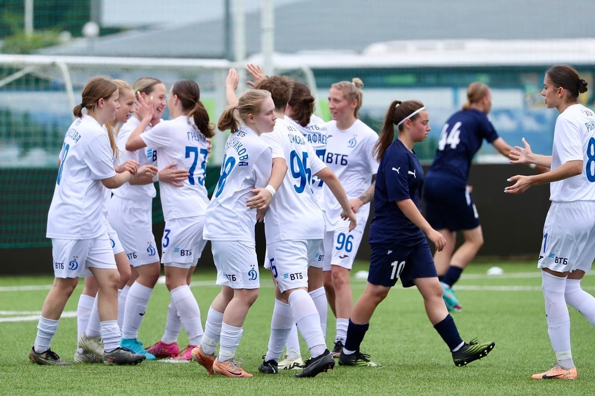 Dynamo football players celebrate scoring a goal