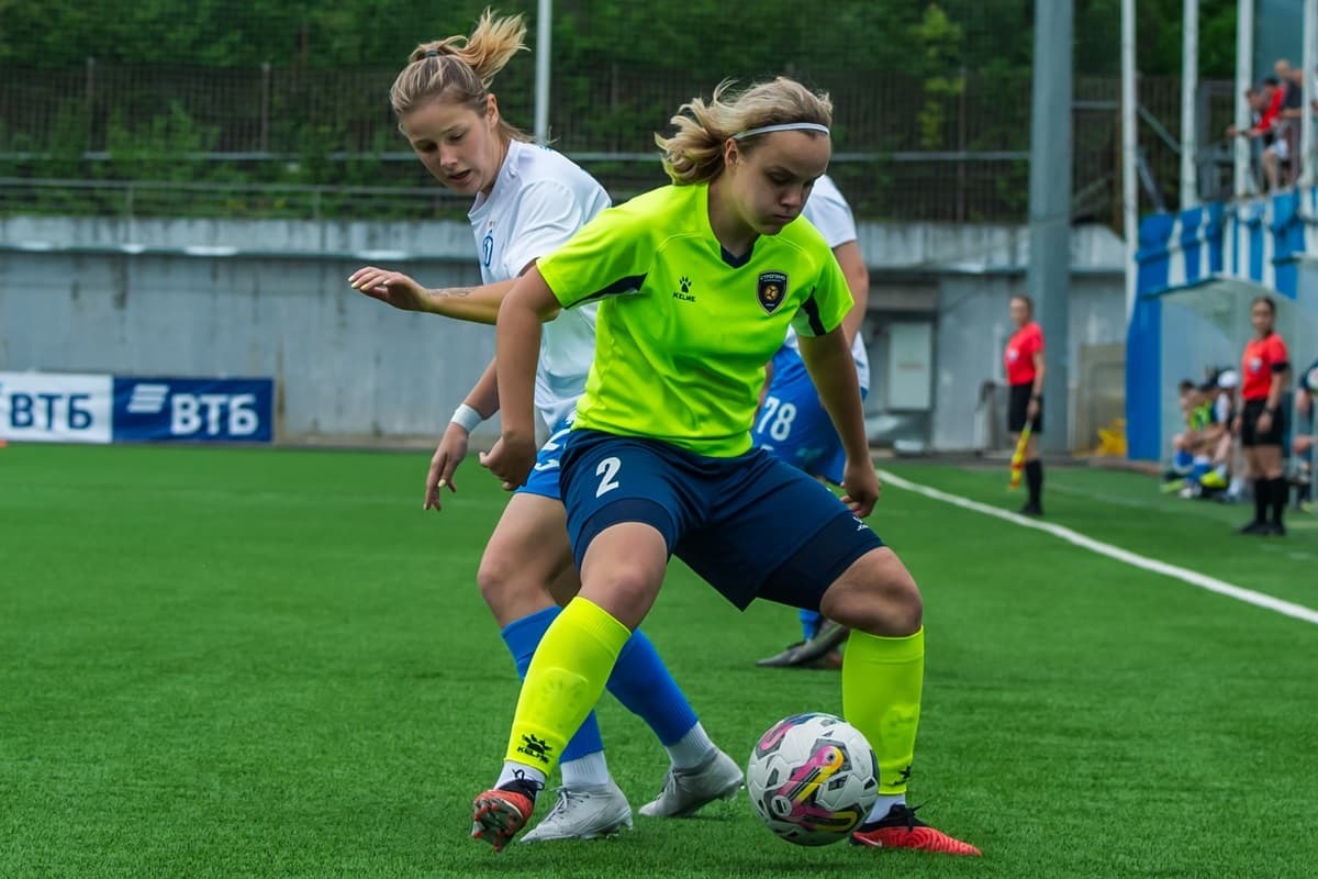 Valeria Azeeva fights for the ball with Strogino defender Maria Mikhailova